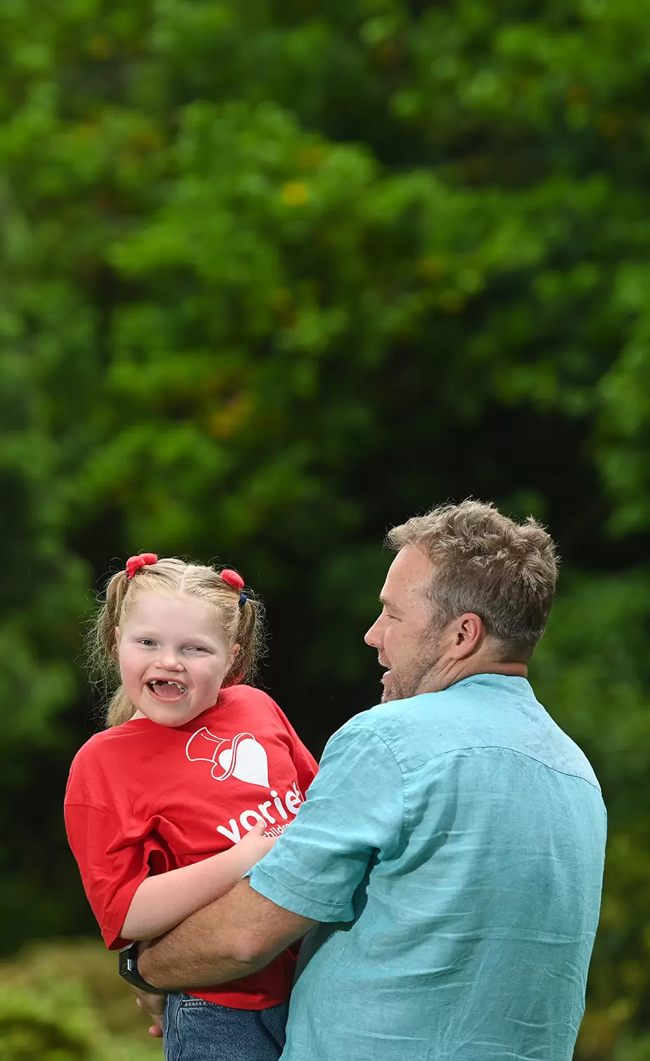 Variety grant recipient very happy in her dads arms