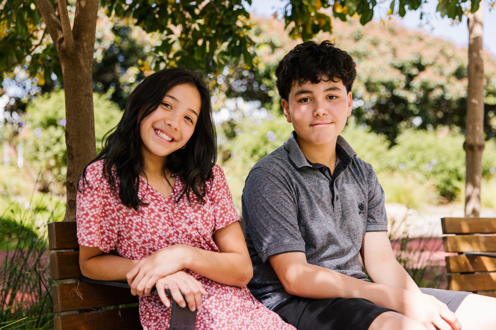 grant recipient with sibling playing on outdoor accessible playground